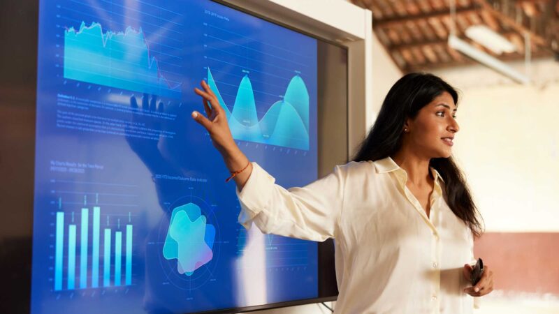 Stock photo of woman presenting data